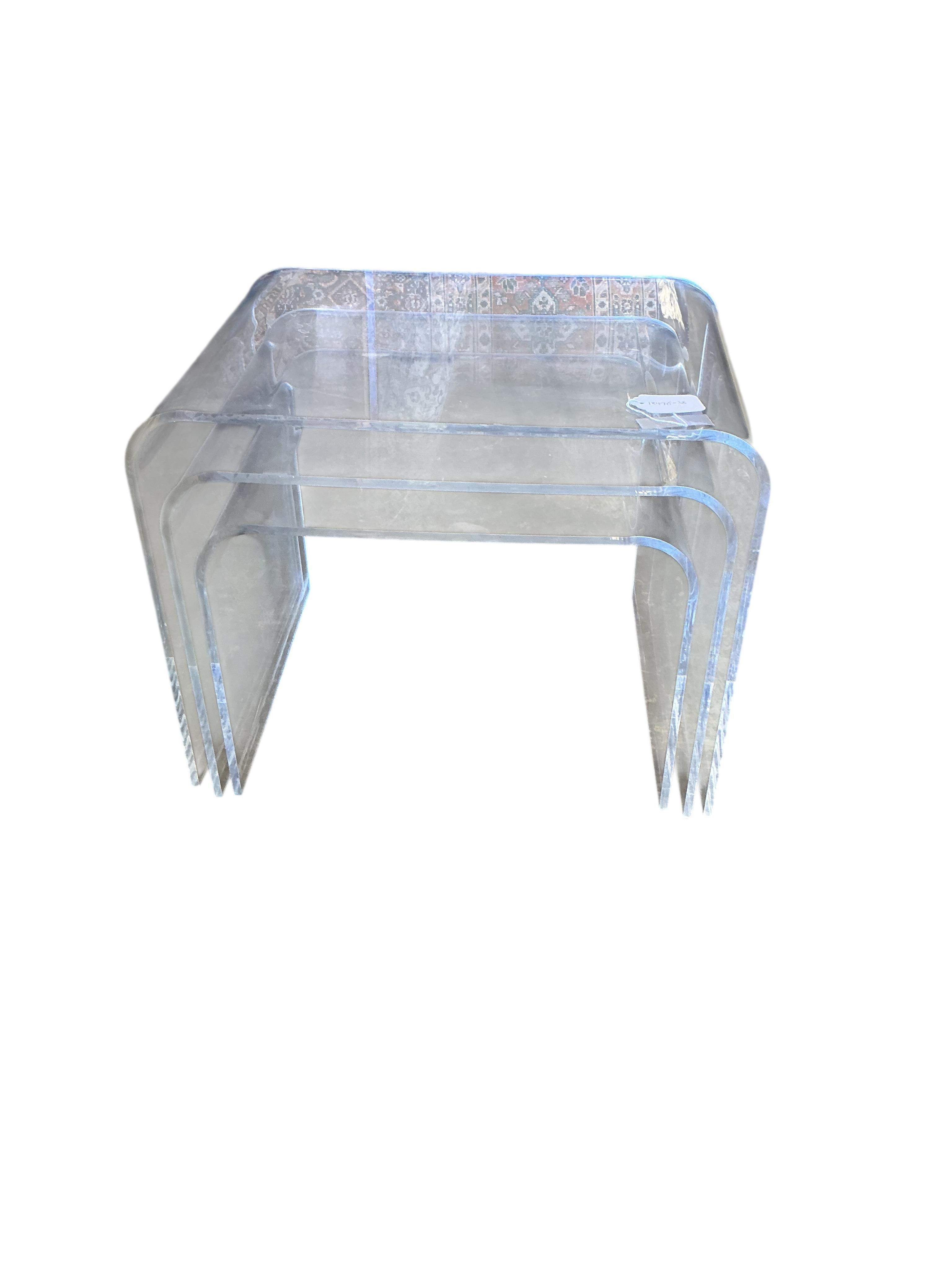 A nest of three Contemporary Perspex tea tables, width 50cm, depth 37cm, height 40cm
